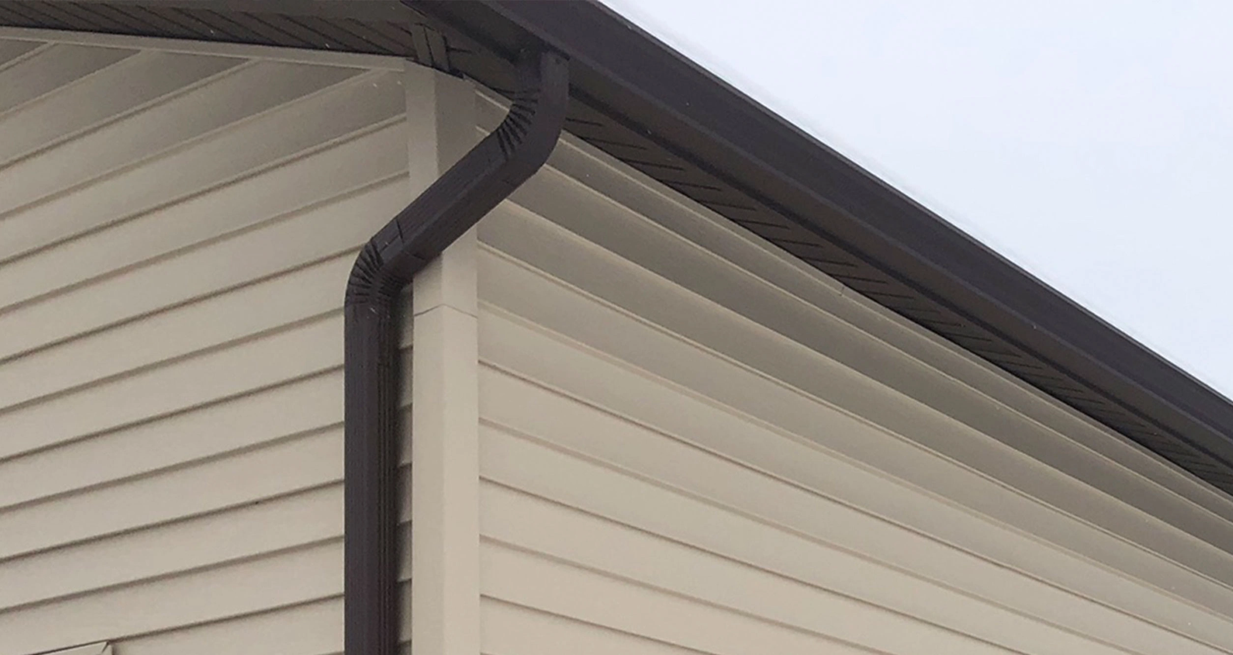 Seamless gutter system installed on a home