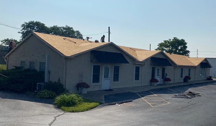 Compromised weather-worn roof before replacement